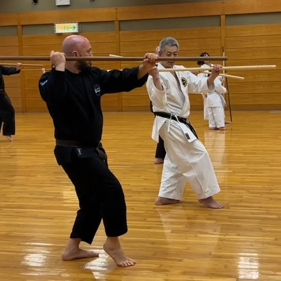 Olgun Tiltay in Nagoya Japan learning Bo [Long staff] from Hideki Yamada Sensei [9th Dan Shorin-Ryu Karate]